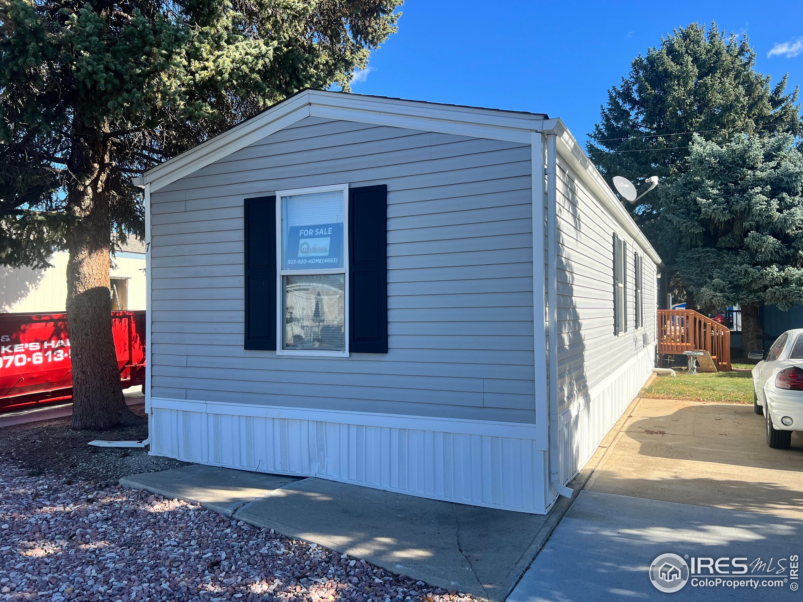230 North 2nd Street, Unit 7 Berthoud, CO 80513 - Photo 2 of 14 a view of a house with a yard