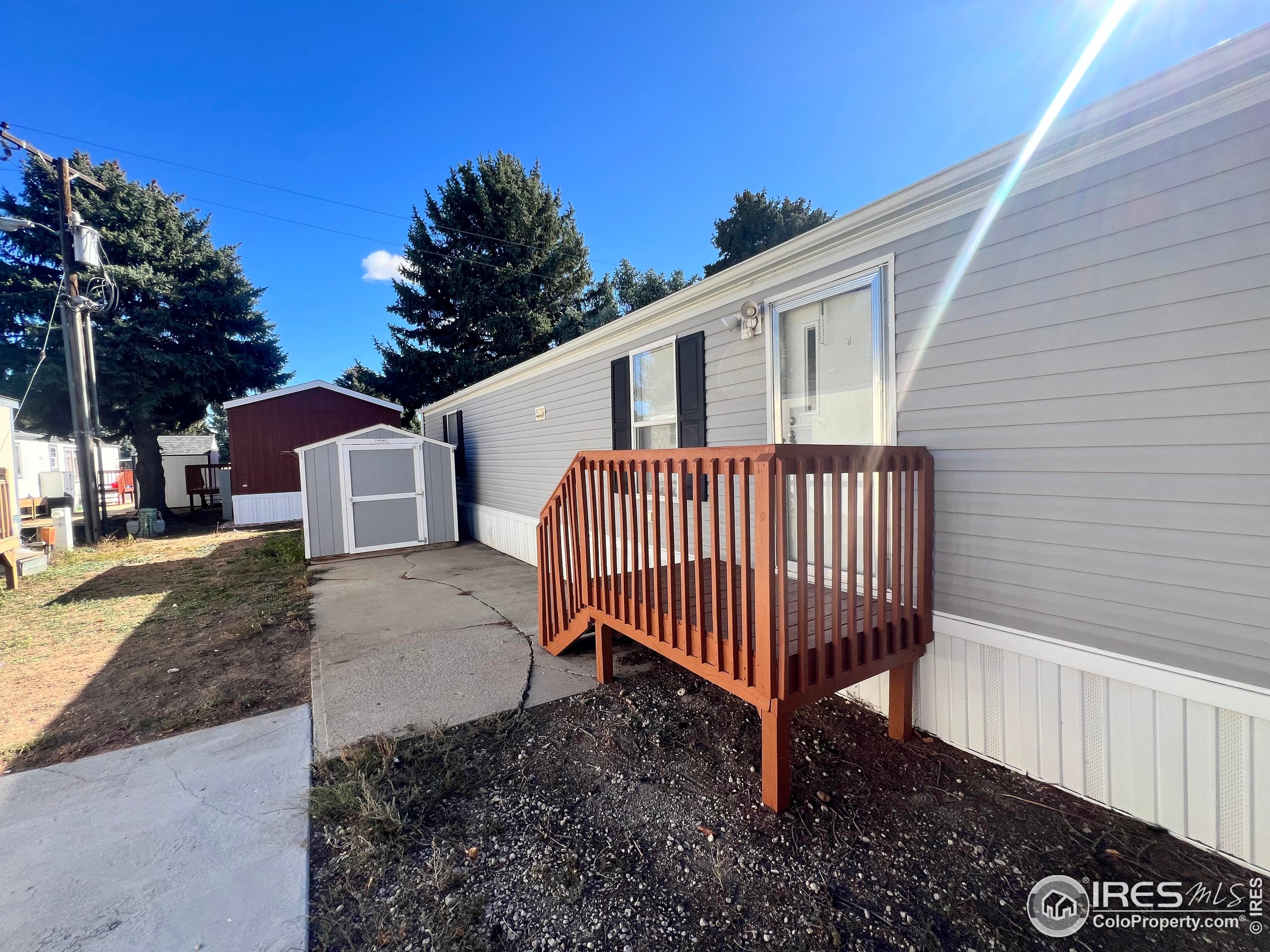 230 North 2nd Street, Unit 7 Berthoud, CO 80513 - Photo 4 of 14 a view of a house with a yard and deck