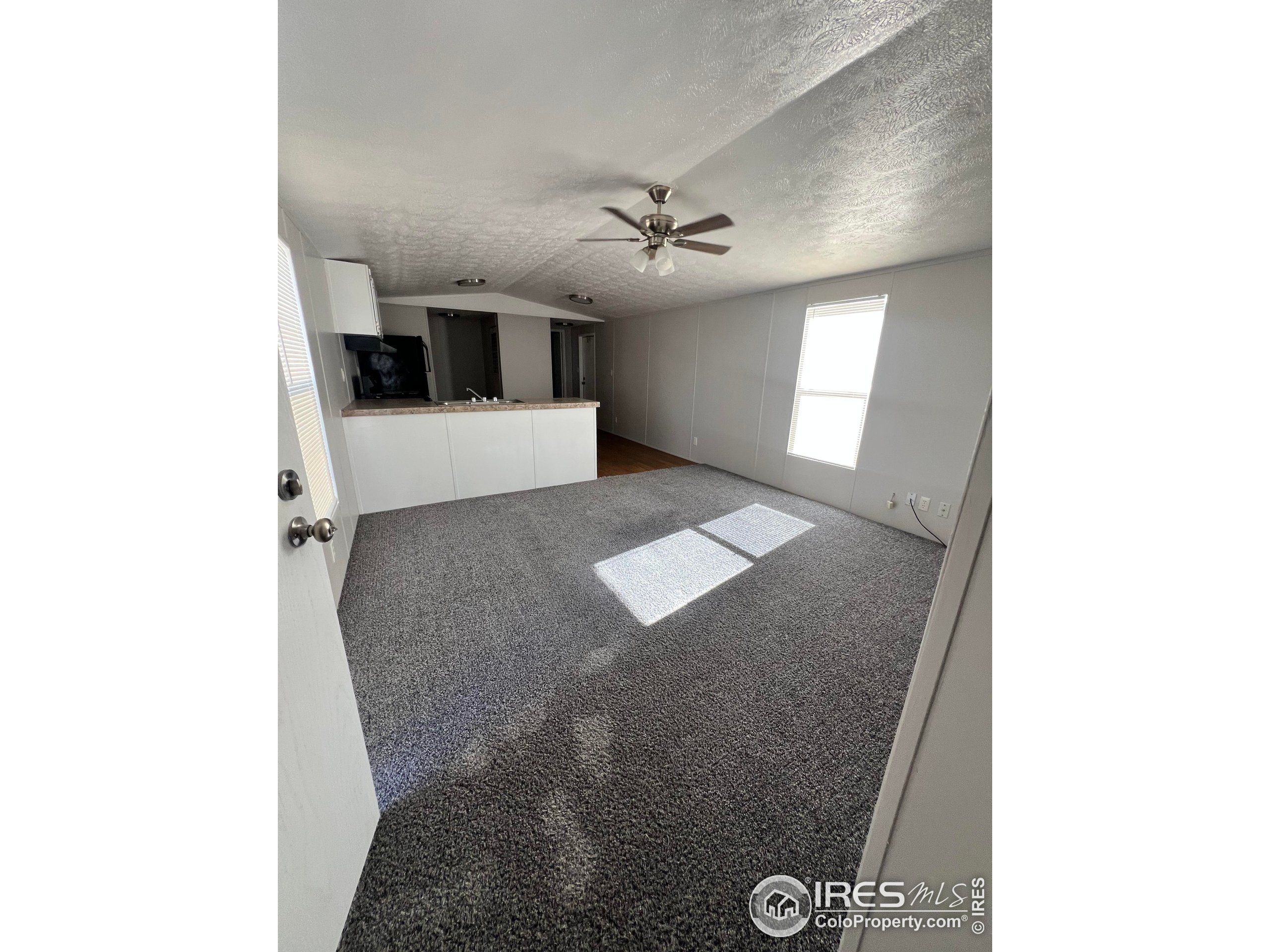230 North 2nd Street, Unit 7 Berthoud, CO 80513 - Photo 6 of 14 a view of a hallway to a house