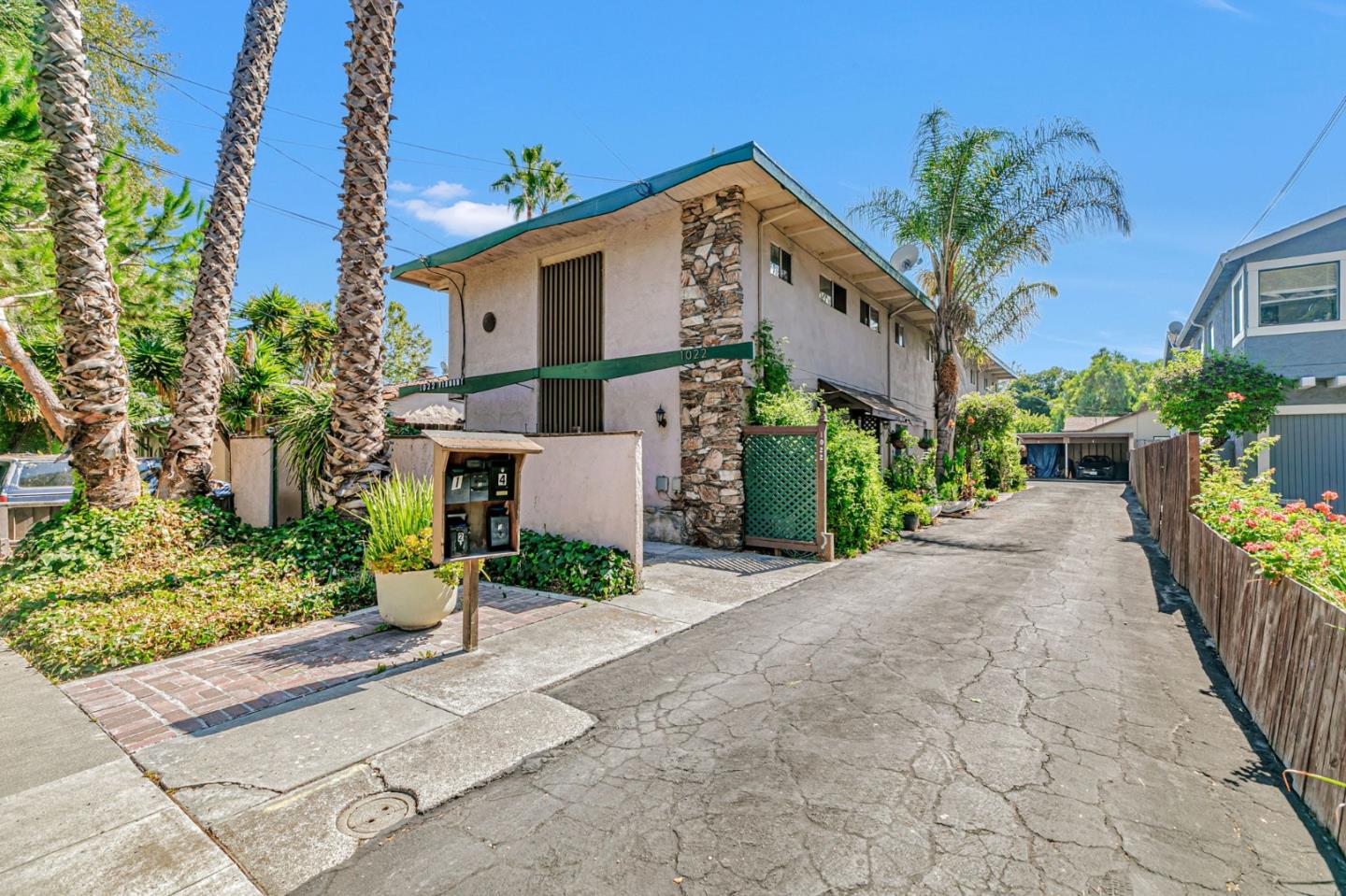 a front view of a house with a yard and a garage
