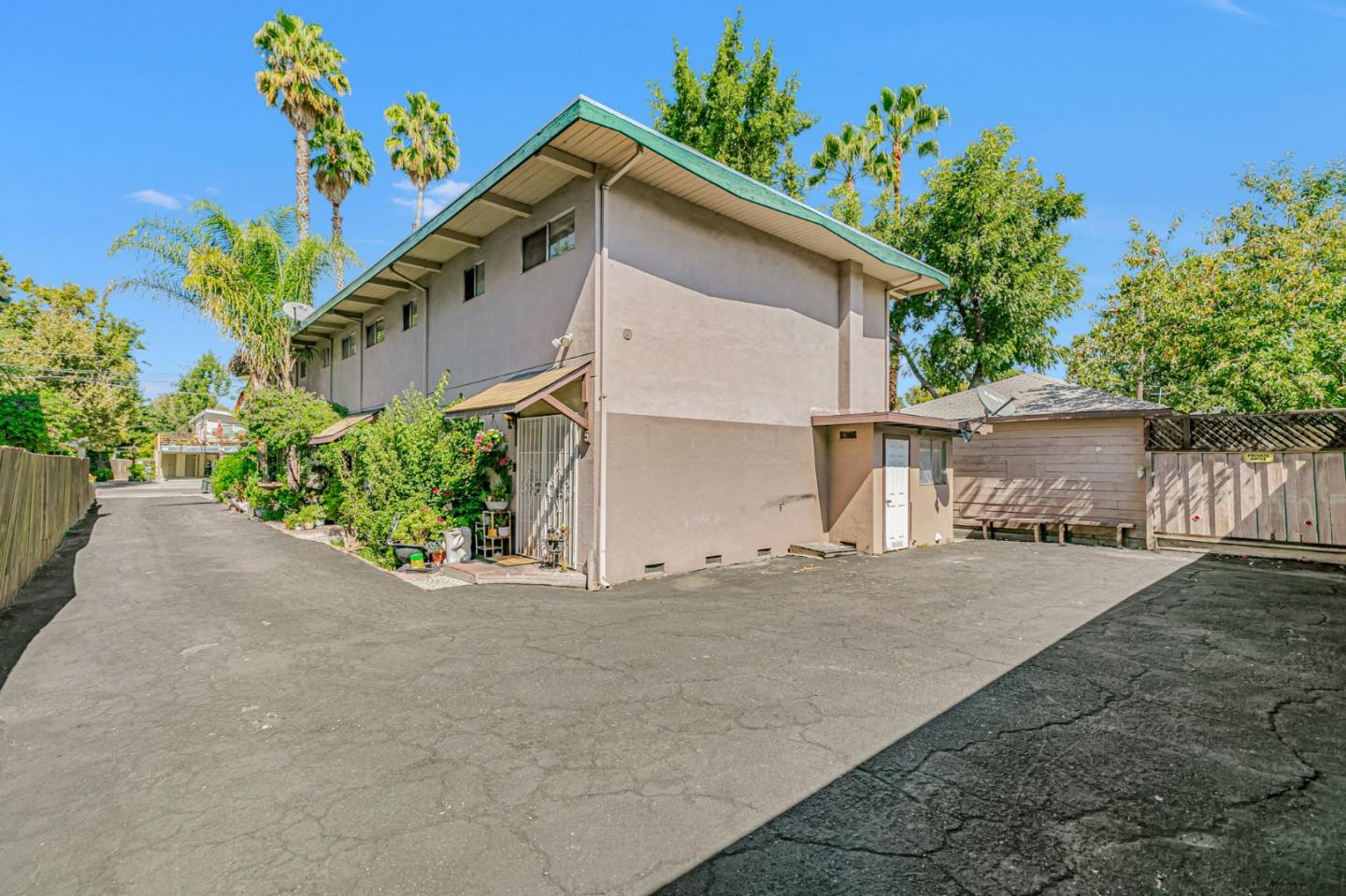 1022 Vermont Street San Jose, CA 95126 - Photo 5 of 23 a view of a house with a yard and a garage