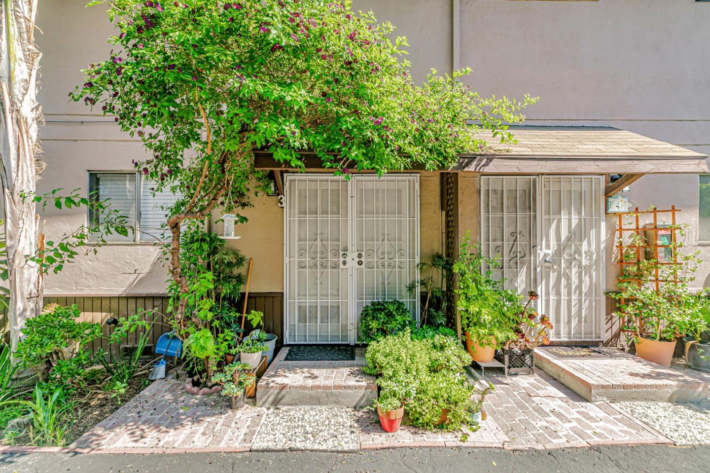 1022 Vermont Street San Jose, CA 95126 - Photo 8 of 23 a view of a house with potted plants and a fountain