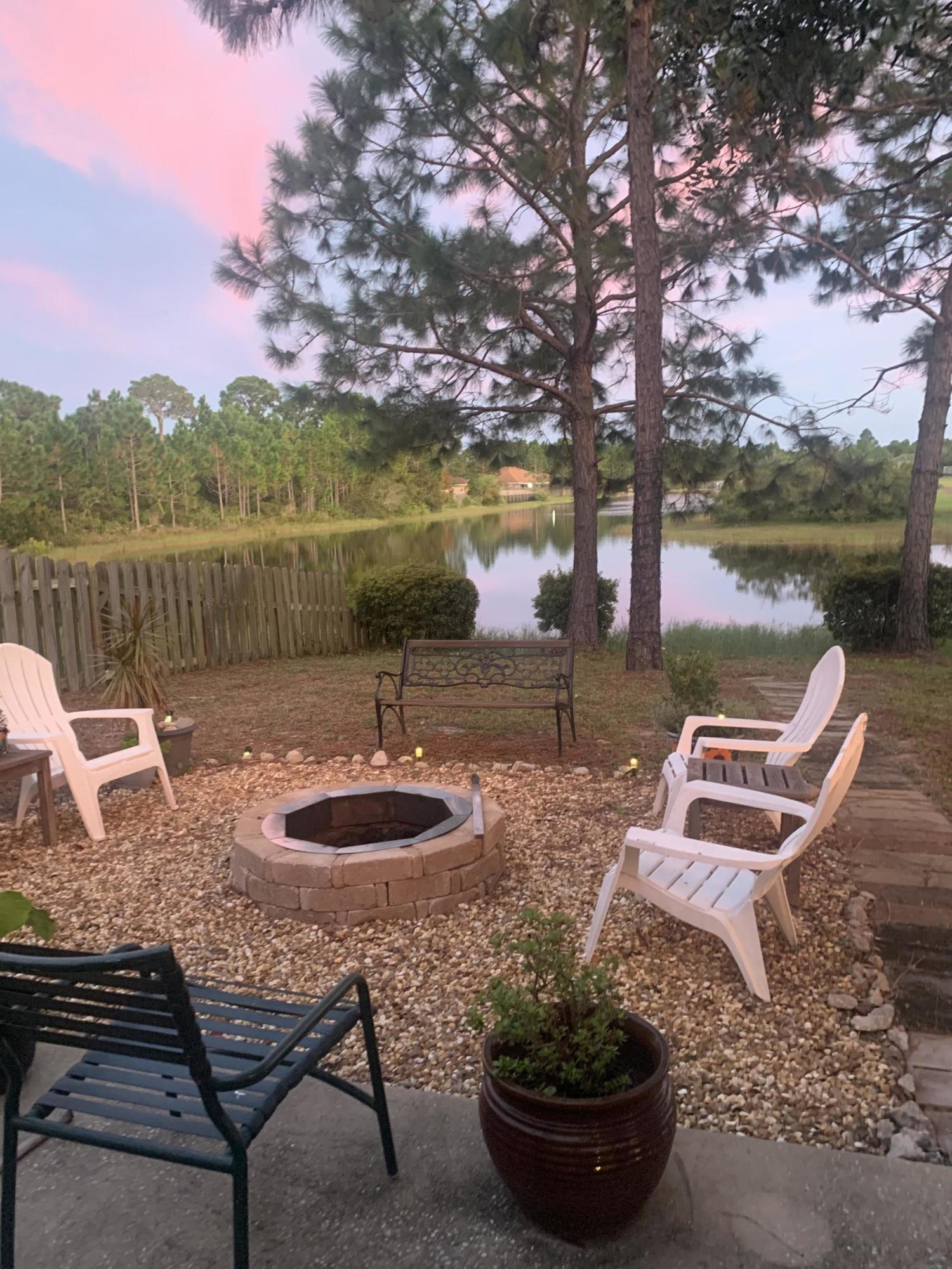 71 South Harborview Road Santa Rosa Beach, FL 32459 - Photo 34 of 38 a view of a backyard with sitting area and lake view