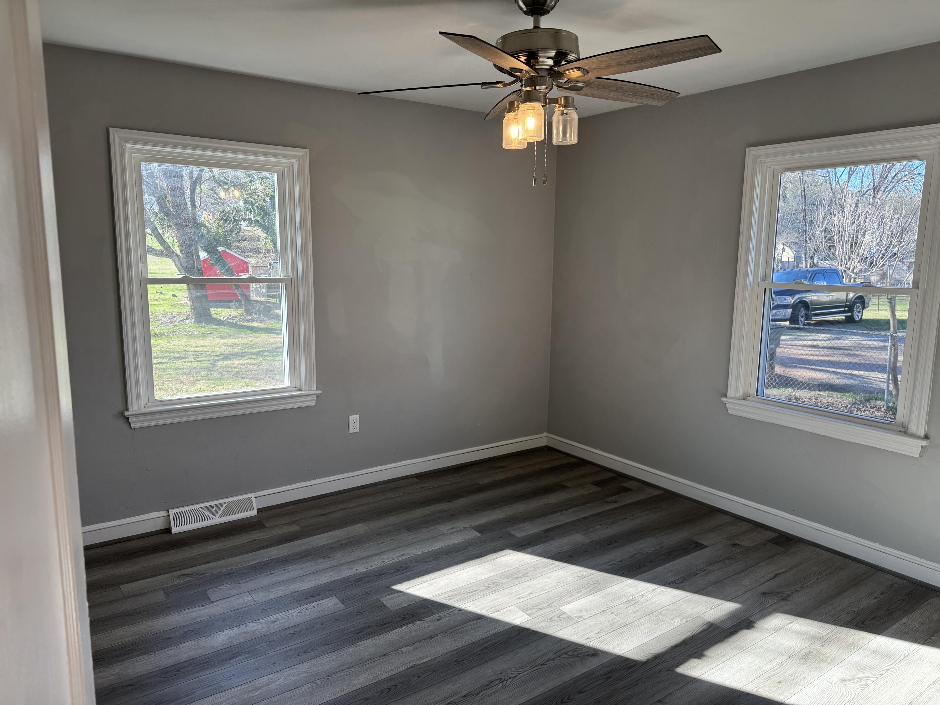 509 Kessler Mill Road, Unit 509 Salem, VA 24153 - Photo 14 of 30 a view of an empty room with wooden floor and a window