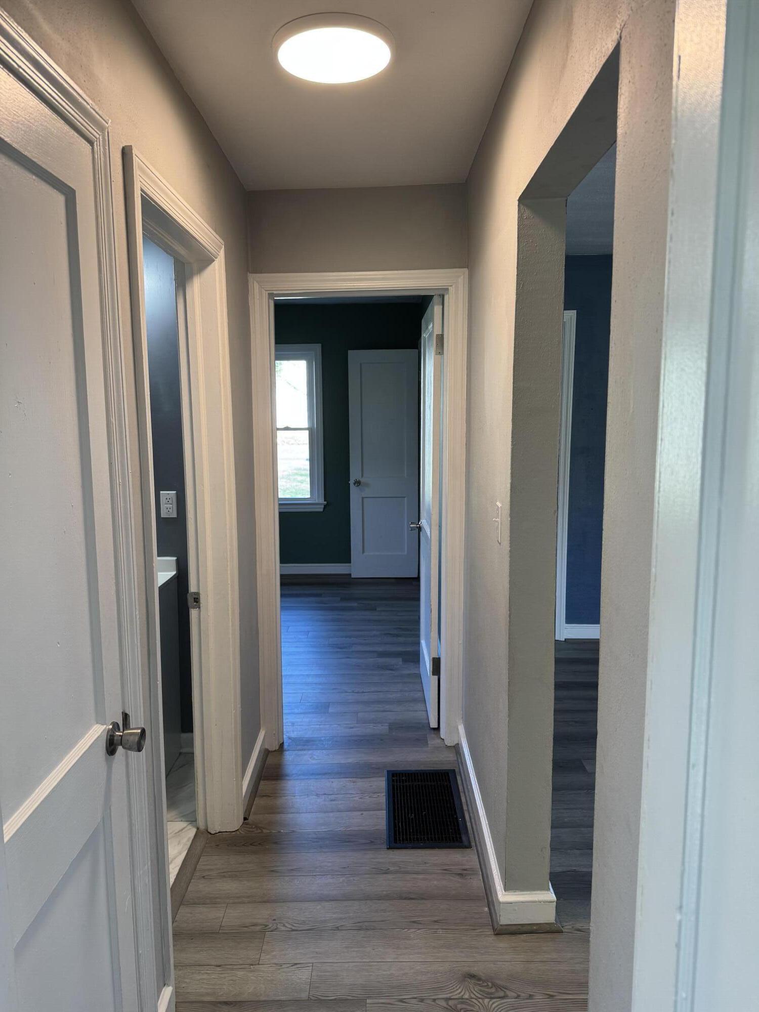509 Kessler Mill Road, Unit 509 Salem, VA 24153 - Photo 15 of 30 a view of a hallway with wooden floor and staircase