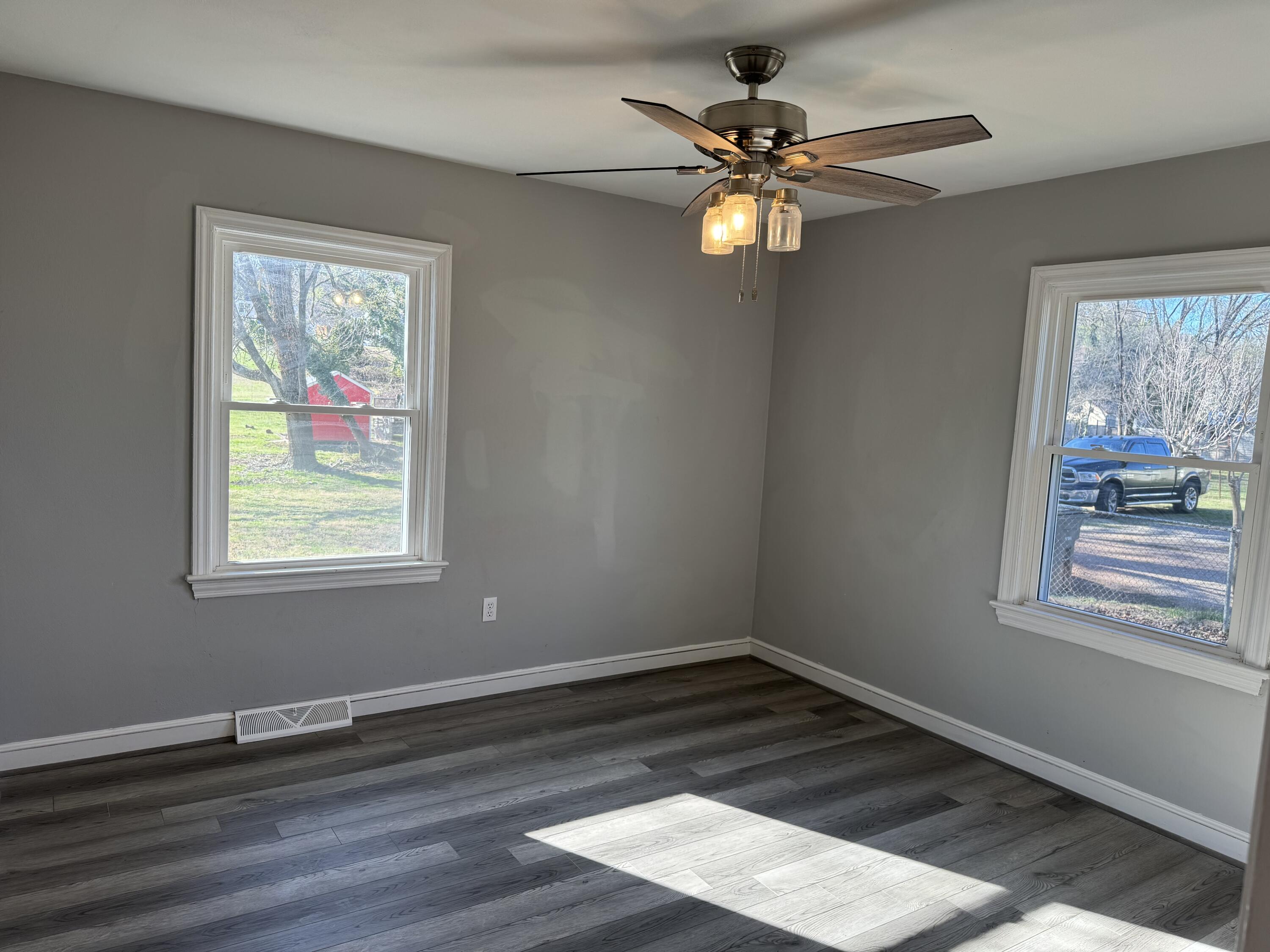 509 Kessler Mill Road, Unit 509 Salem, VA 24153 - Photo 19 of 30 a view of an empty room with wooden floor and a window