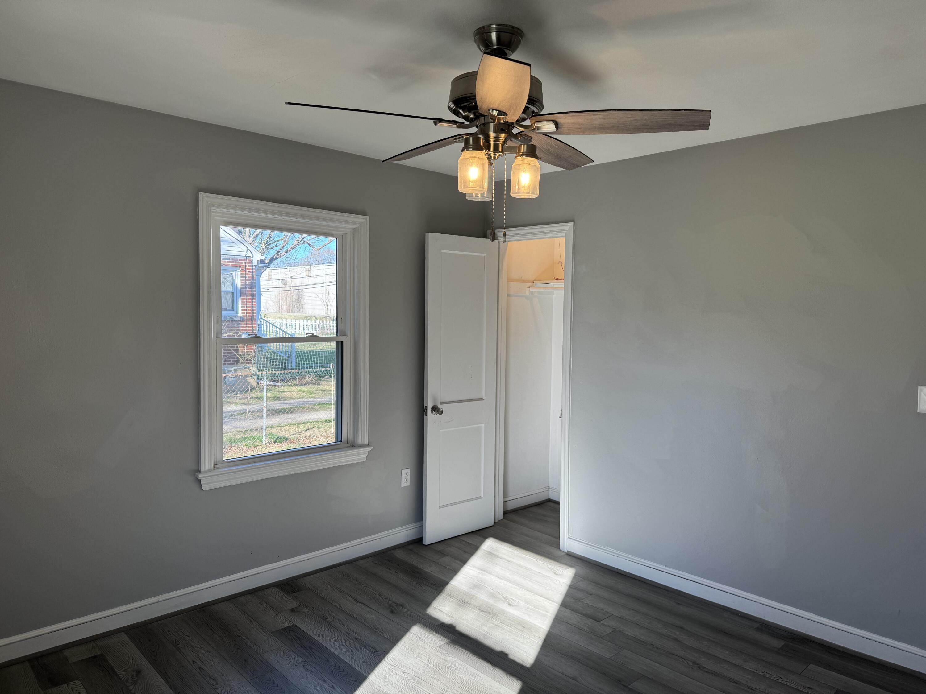 509 Kessler Mill Road, Unit 509 Salem, VA 24153 - Photo 20 of 30 a view of an empty room with a window and wooden floor