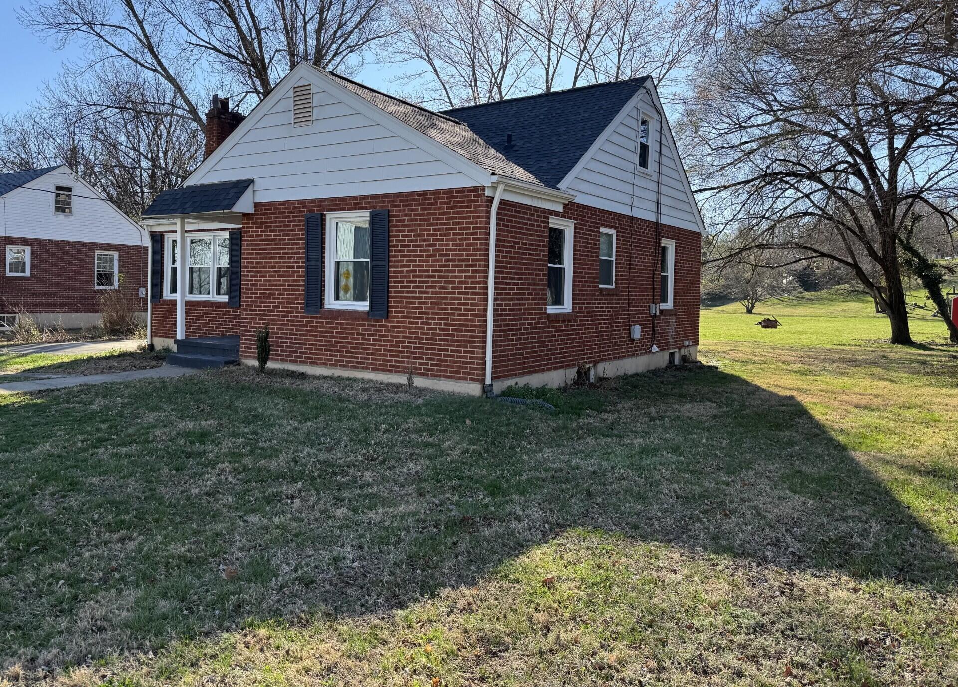 509 Kessler Mill Road, Unit 509 Salem, VA 24153 - Photo 29 of 30 a front view of a house with a garden and yard