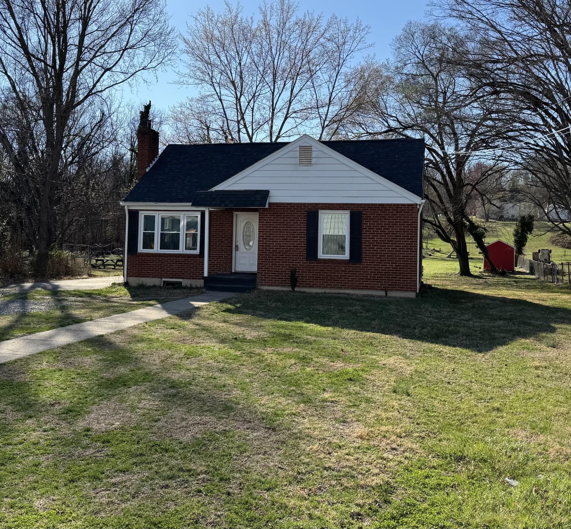 509 Kessler Mill Road, Unit 509 Salem, VA 24153 - Photo 30 of 30 a front view of house with yard and trees around