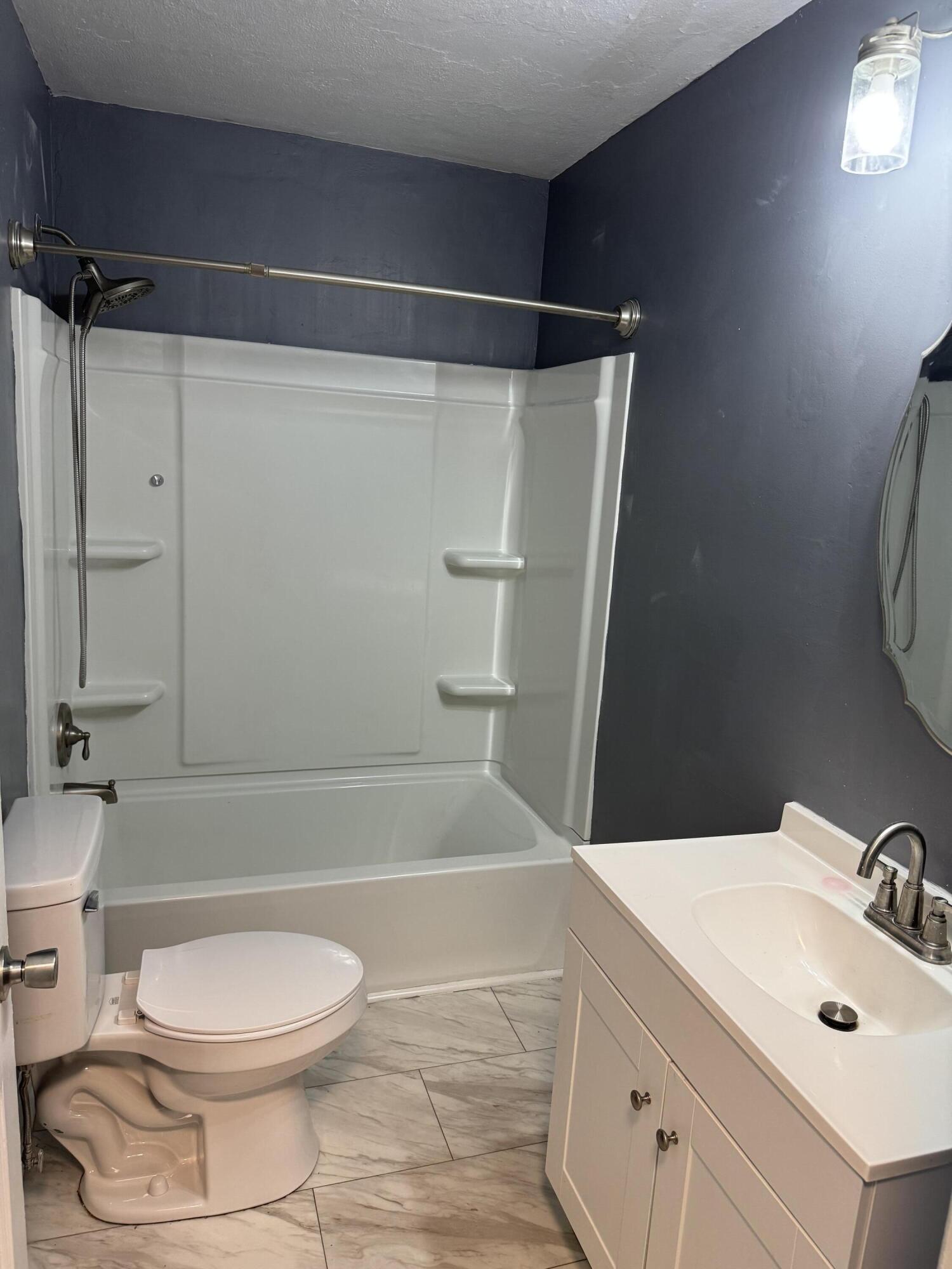 509 Kessler Mill Road, Unit 509 Salem, VA 24153 - Photo 8 of 30 a bathroom with a sink toilet and shower