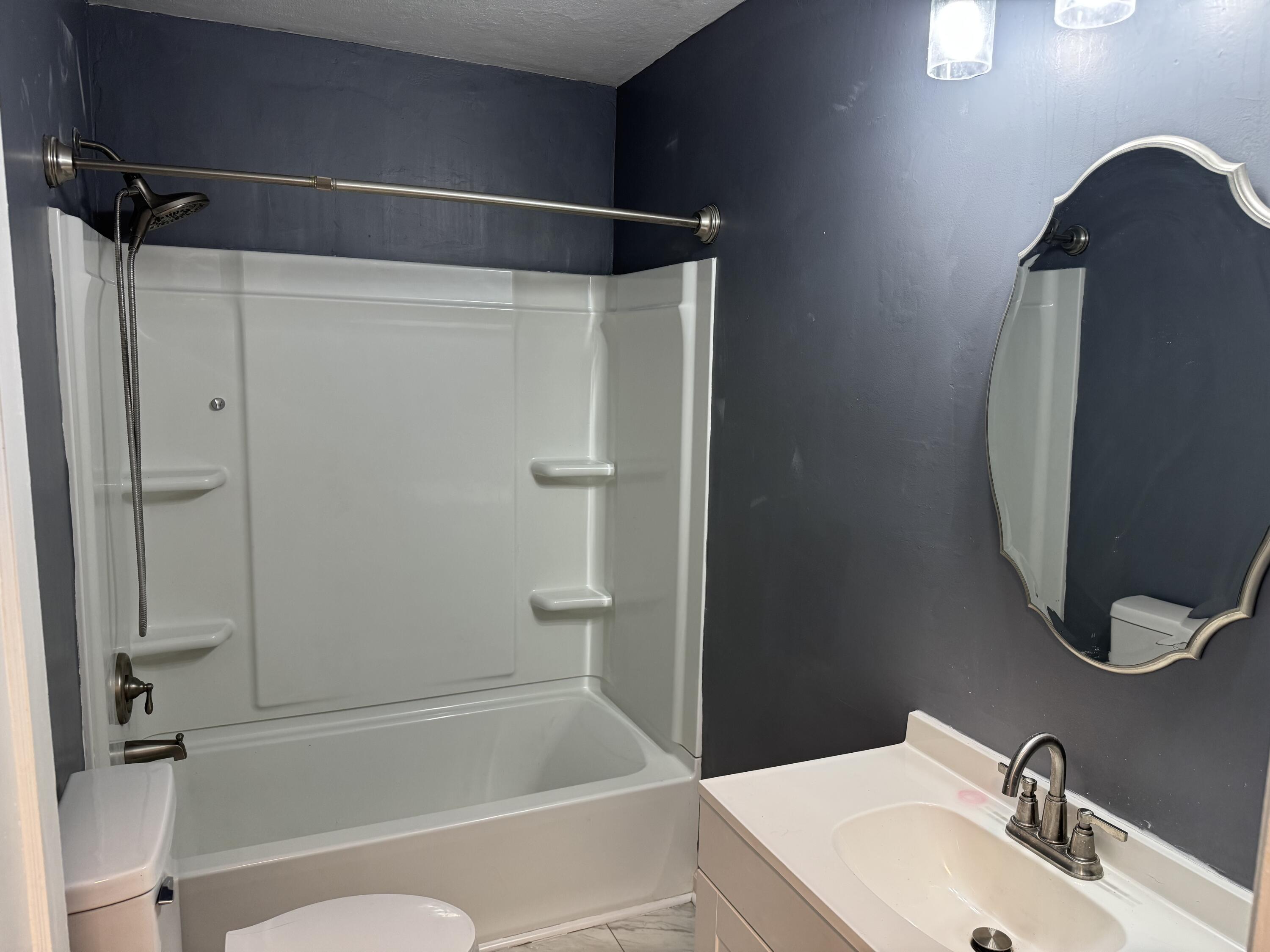 509 Kessler Mill Road, Unit 509 Salem, VA 24153 - Photo 9 of 30 a bathroom with a sink and a mirror