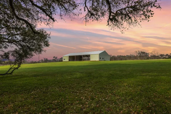a backyard of a house with lots of green space