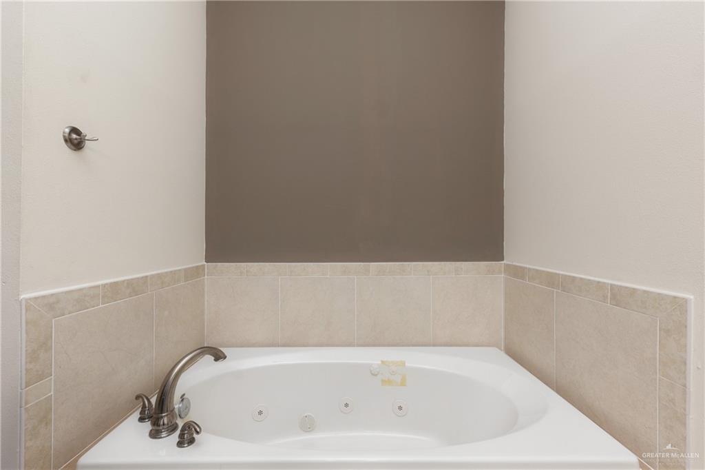 210 North 18th Street Hidalgo, TX 78557 - Photo 13 of 24 Bathroom with a tub with jets