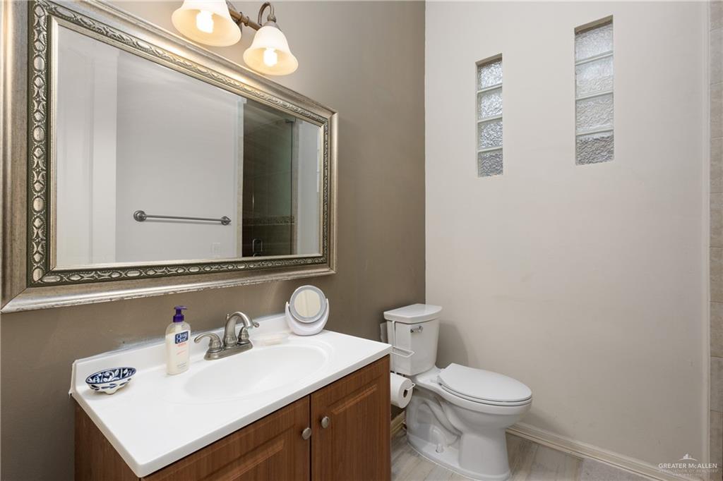 210 North 18th Street Hidalgo, TX 78557 - Photo 19 of 24 Full bath featuring vanity and toilet