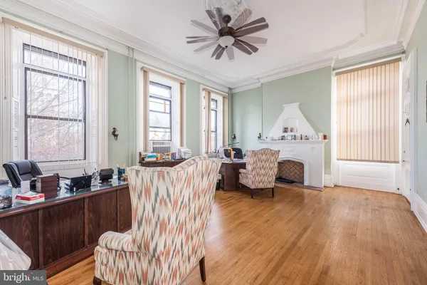 a view of a livingroom with furniture and a fireplace