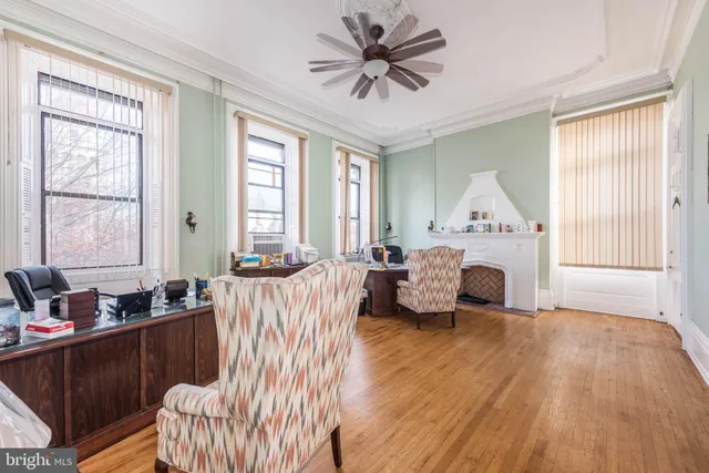 a view of a livingroom with furniture and a fireplace