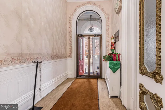 a view of entryway with wooden floor