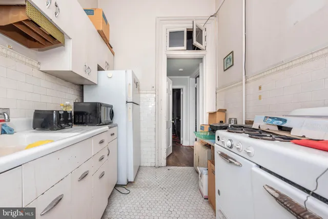 a front view of a house with large windows