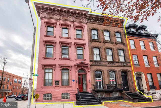 a front view of a building with street view