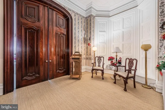 a view of a livingroom with furniture and a fireplace