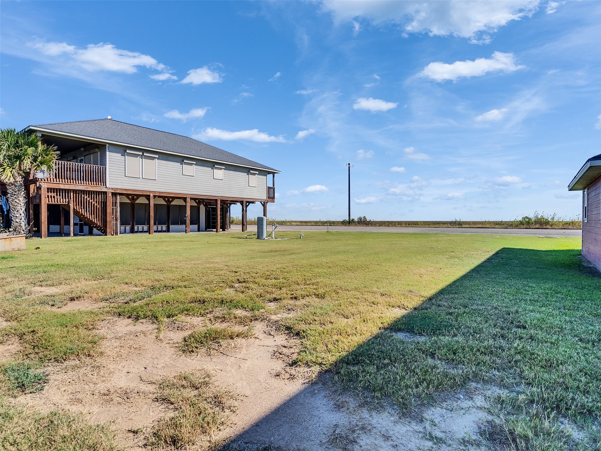 0 Fm-2031 Beach Road Matagorda, TX 77457 - Photo 14 of 16 a view of a swimming pool with an outdoor space and seating area