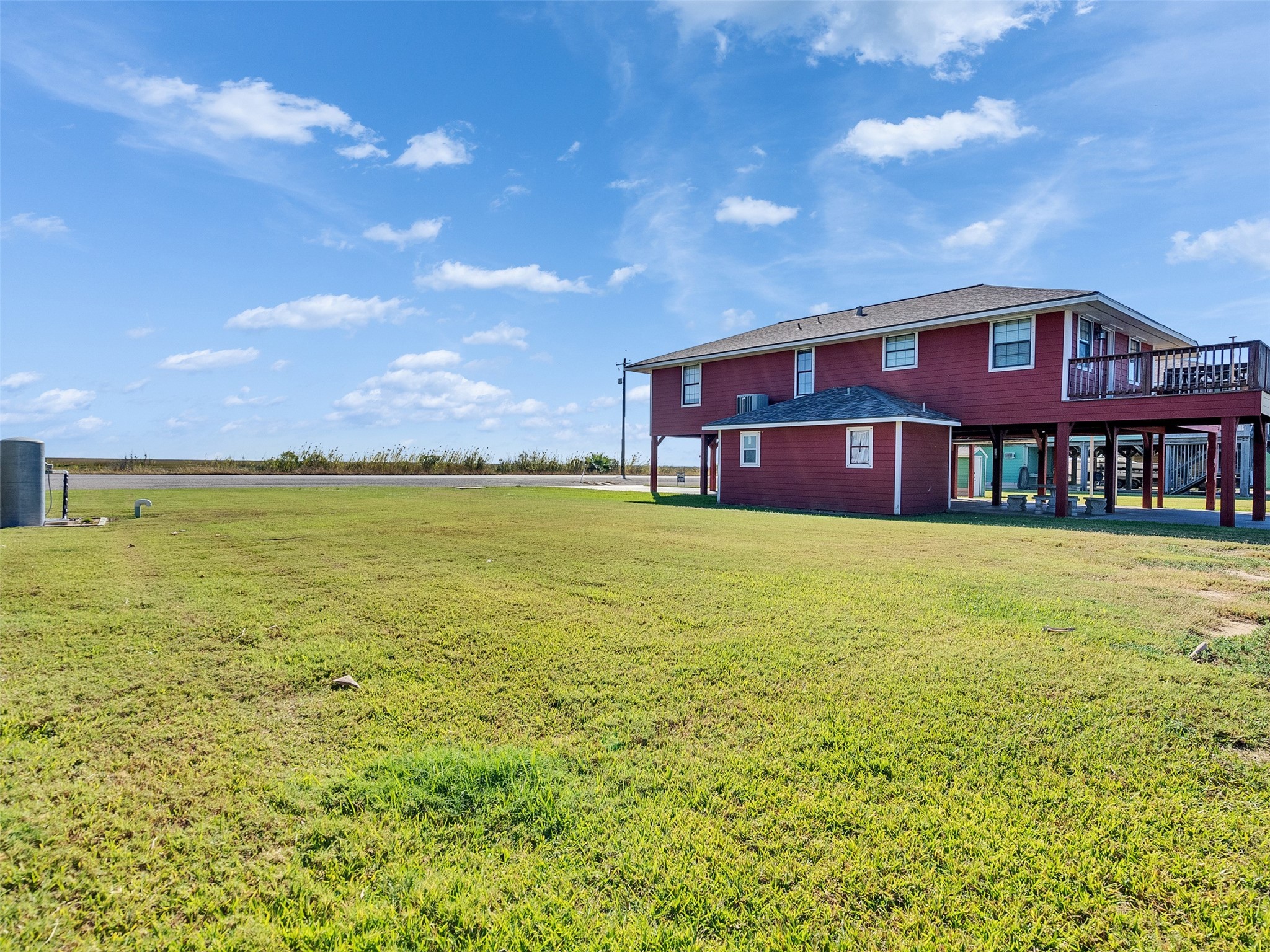 0 Fm-2031 Beach Road Matagorda, TX 77457 - Photo 16 of 16 a front view of a house with a yard