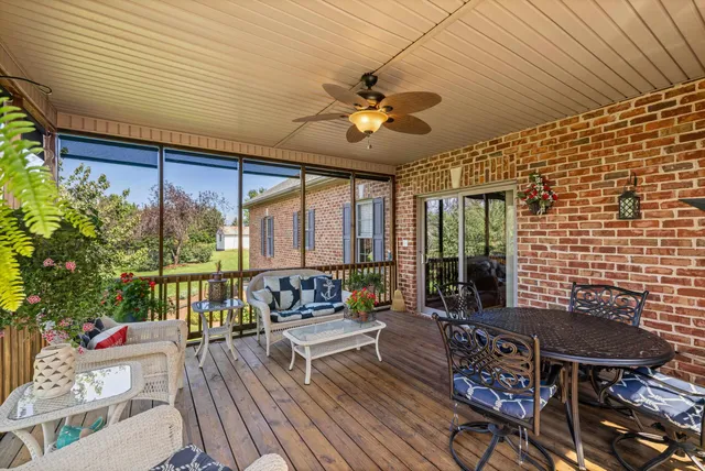 a view of a chairs and table on the deck