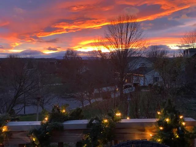 a bedroom with furniture and a flat screen tv