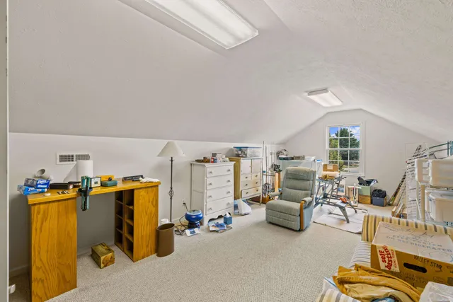 a view of a garage and car parked