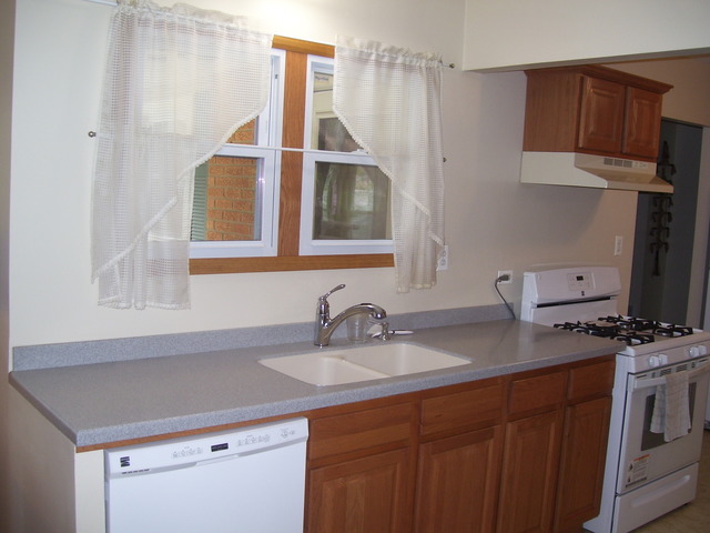360 Ahlstrand Road Lombard, IL 60148 - Photo 16 of 21 a kitchen with a sink cabinets and appliances