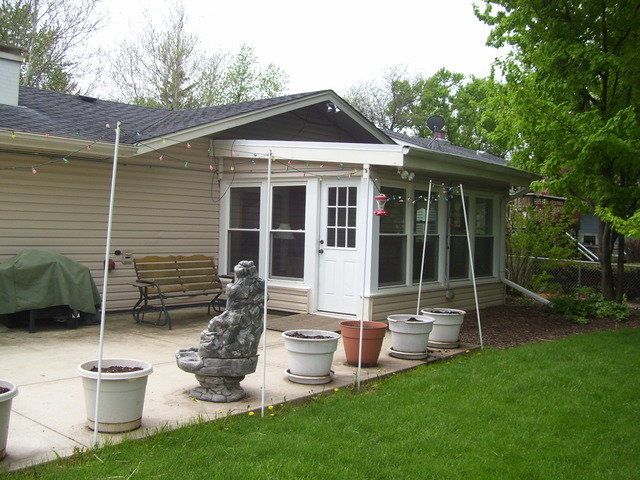 360 Ahlstrand Road Lombard, IL 60148 - Photo 2 of 21 a front view of a house with a garden and yard