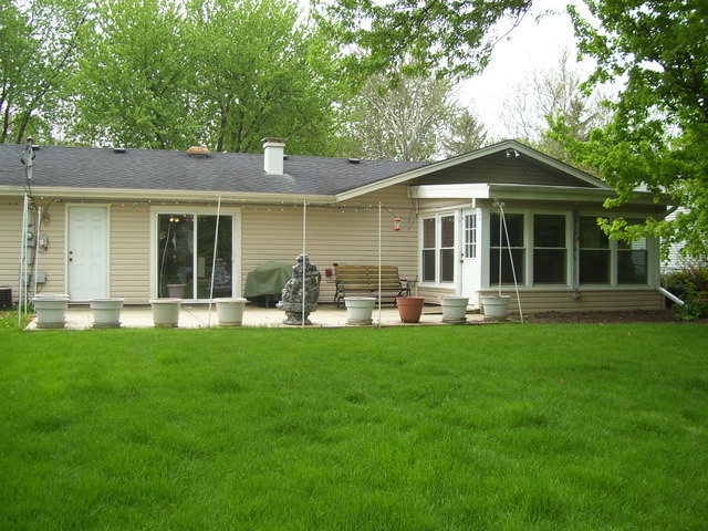 360 Ahlstrand Road Lombard, IL 60148 - Photo 3 of 21 a front view of house with yard barbeque and green space