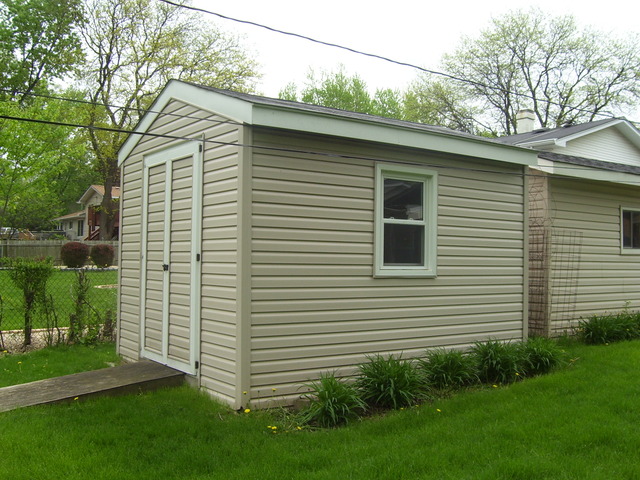 360 Ahlstrand Road Lombard, IL 60148 - Photo 6 of 21 a view of a house with a yard and plants