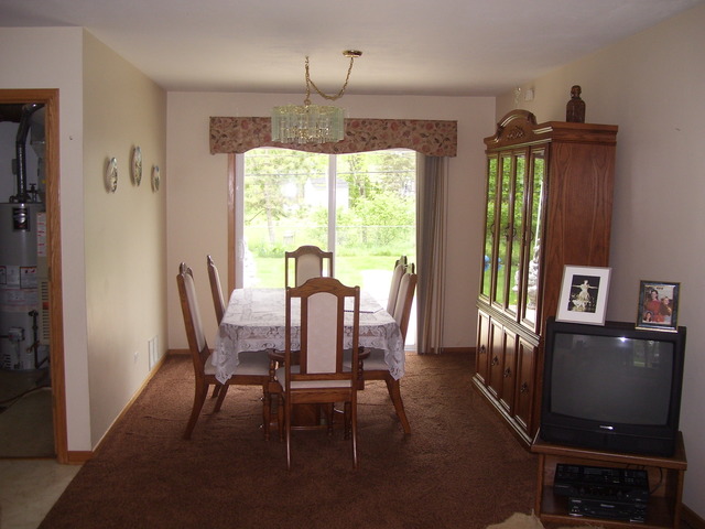 360 Ahlstrand Road Lombard, IL 60148 - Photo 8 of 21 a view of a dining room with furniture window and outside view