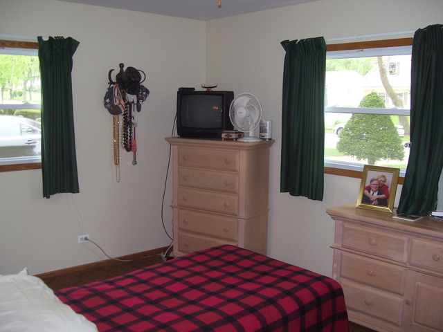 360 Ahlstrand Road Lombard, IL 60148 - Photo 10 of 21 a bedroom with a bed and a window