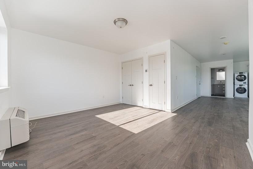 6649 Ridge Avenue, Unit A416 Philadelphia, PA 19128 - Photo 6 of 7 a view of an empty room and wooden floor