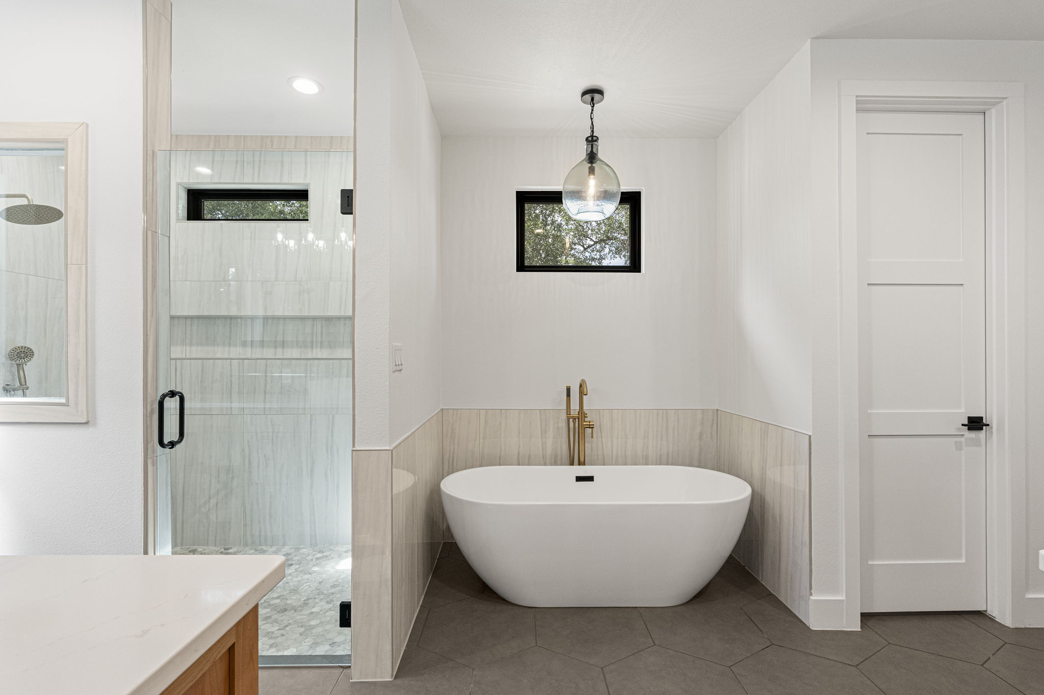 32831 Ranch Road 12 Dripping Springs, TX 78620 - Photo 18 of 40 Primary bath has full sized shower and stand alone tub