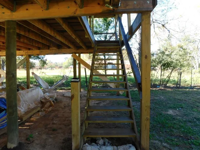 a view of balcony and yard