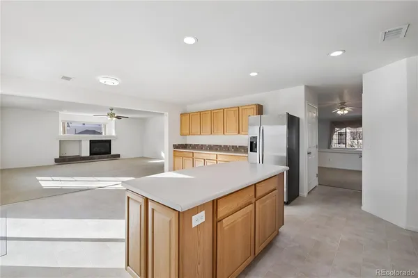 a kitchen with a sink and a refrigerator