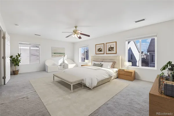 a bedroom with a bed and a couch