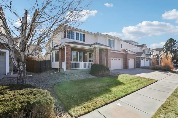 a view of a front of a house with a yard