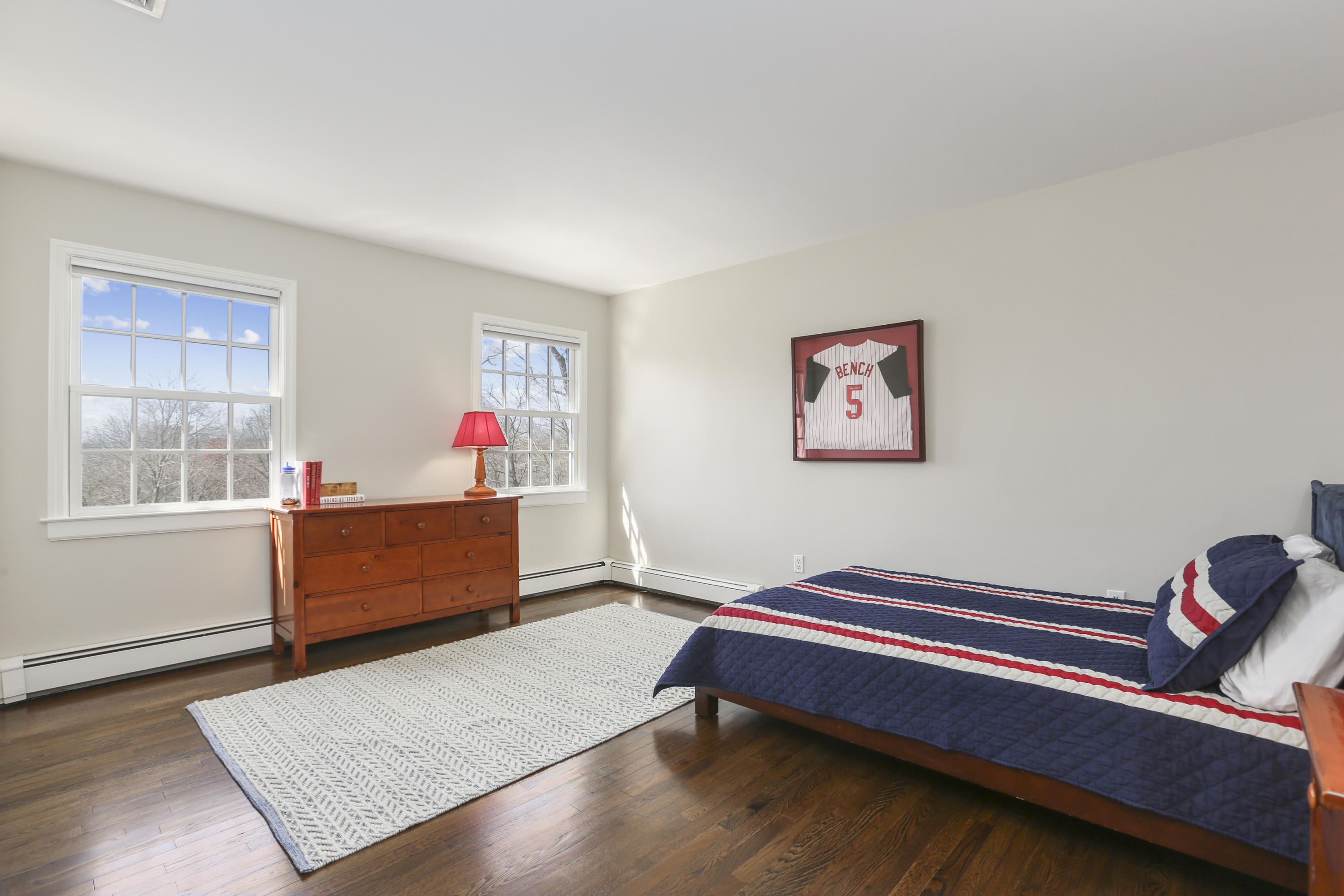 183 Brushy Ridge Road New Canaan, CT 06840 - Photo 29 of 41 a room with furniture wall paintings and a window