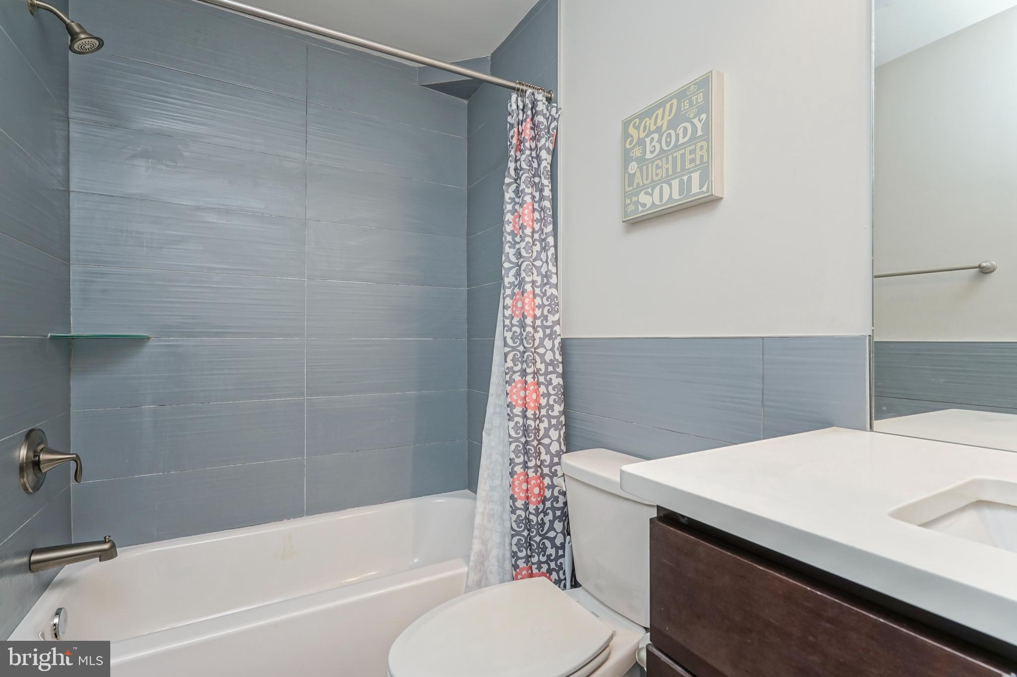 2332 Ellsworth Street Philadelphia, PA 19146 - Photo 13 of 29 a bathroom with a sink a toilet and a bathtub
