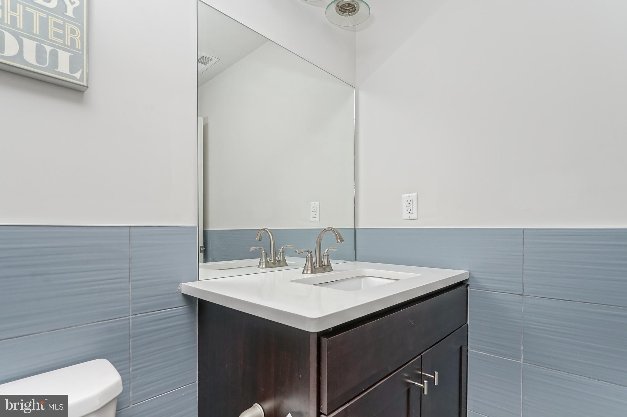 2332 Ellsworth Street Philadelphia, PA 19146 - Photo 14 of 29 a bathroom with a sink and a mirror