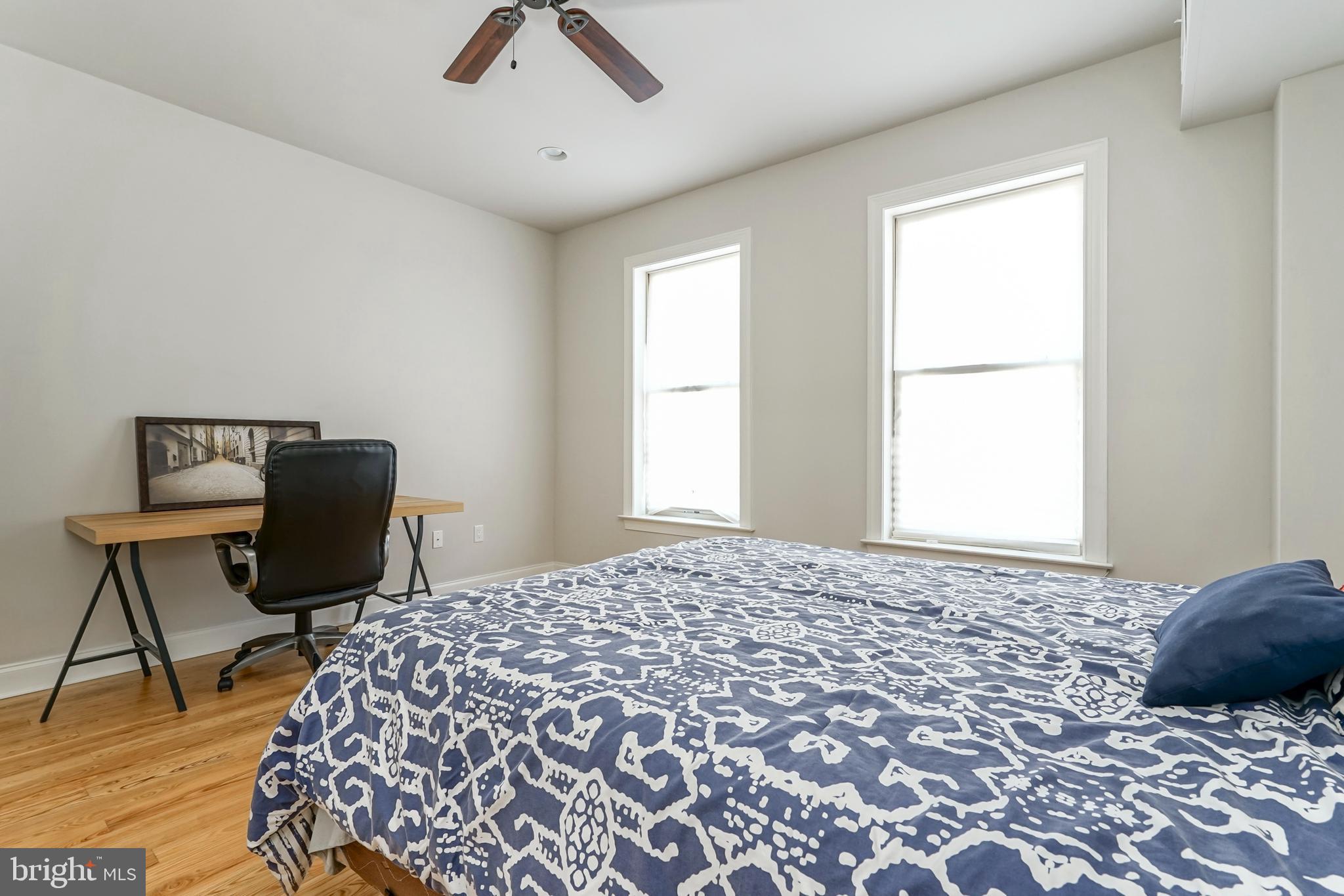 2332 Ellsworth Street Philadelphia, PA 19146 - Photo 16 of 29 a bedroom with a bed and chair