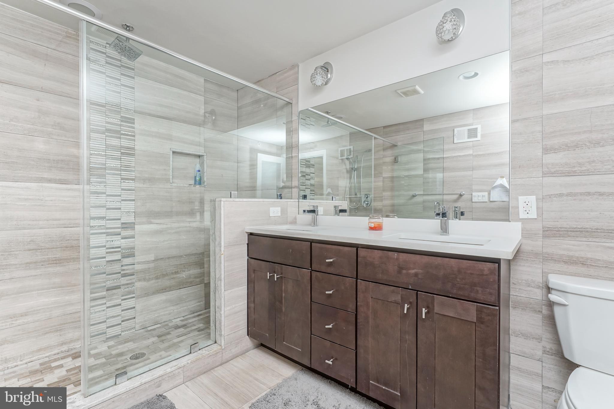 2332 Ellsworth Street Philadelphia, PA 19146 - Photo 19 of 29 a bathroom with a sink and a mirror