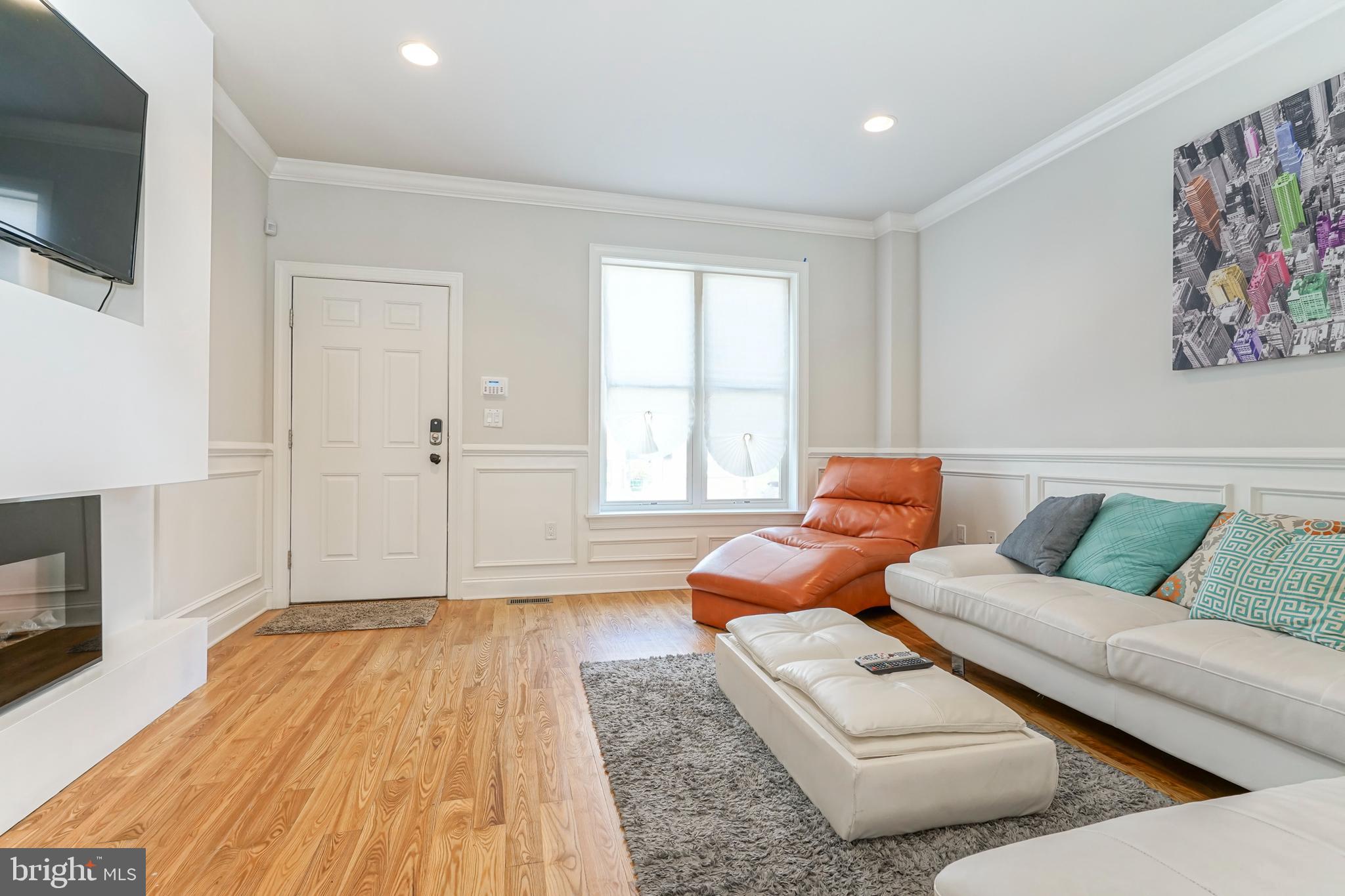 2332 Ellsworth Street Philadelphia, PA 19146 - Photo 3 of 29 a living room with furniture and a flat screen tv