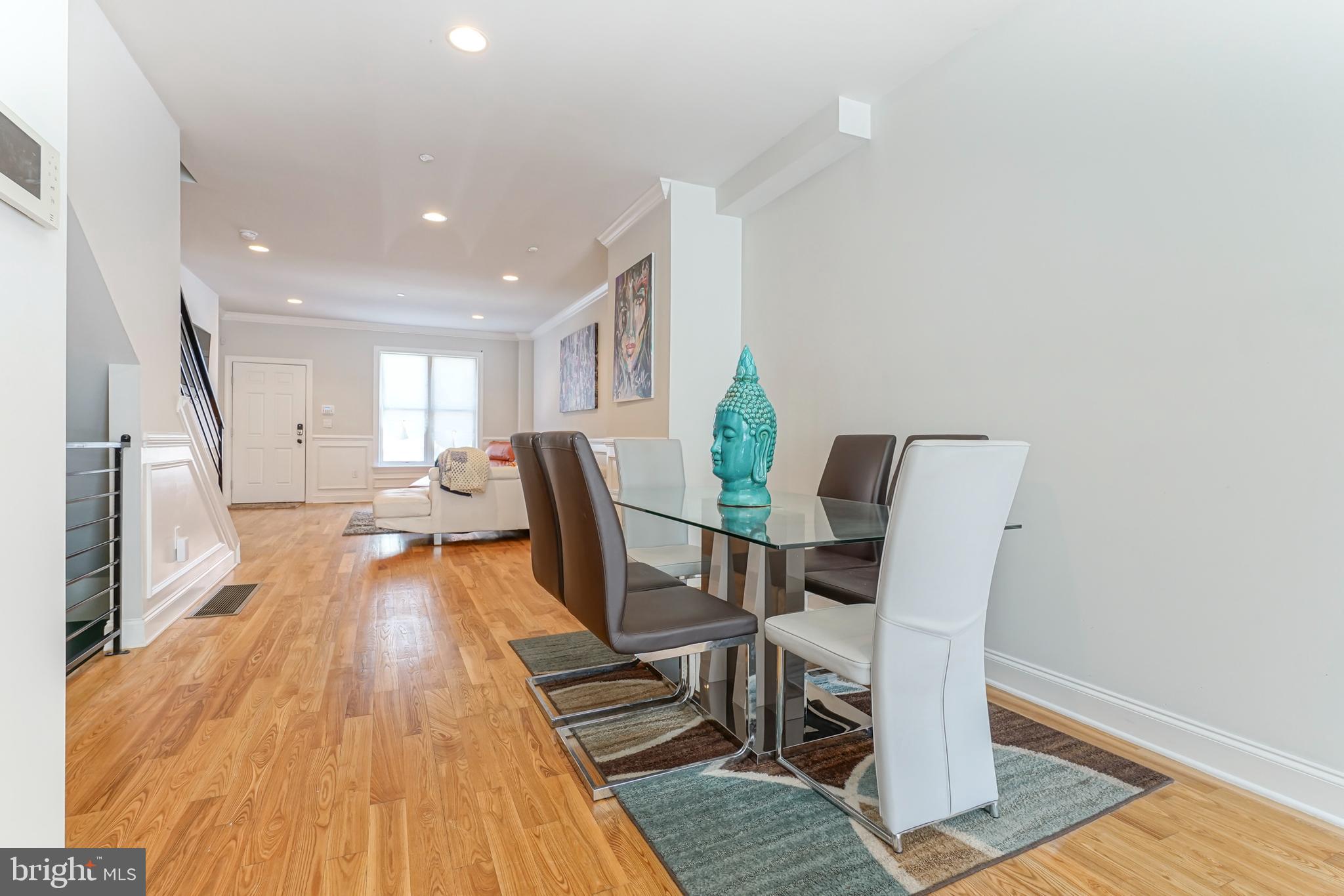 2332 Ellsworth Street Philadelphia, PA 19146 - Photo 4 of 29 a view of a dining room with furniture and wooden floor