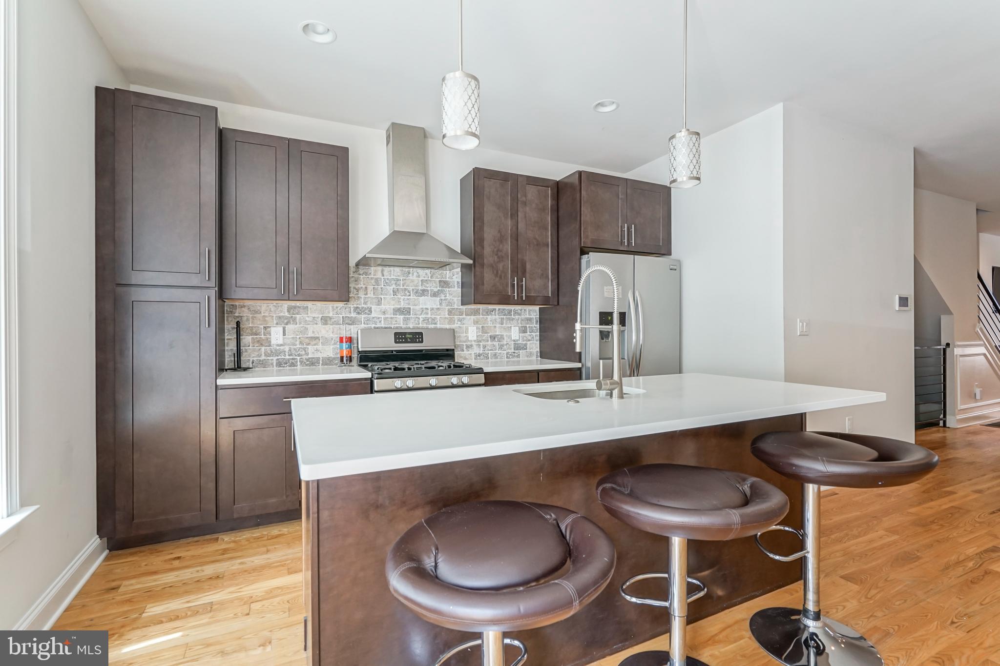 2332 Ellsworth Street Philadelphia, PA 19146 - Photo 7 of 29 a kitchen with stainless steel appliances a sink and a refrigerator