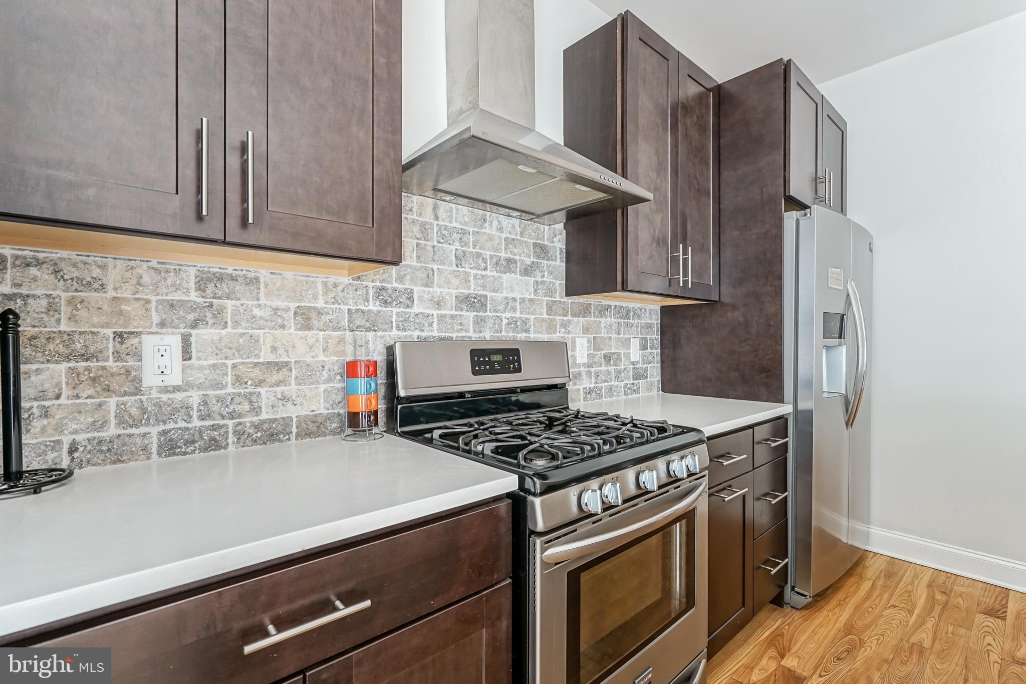 2332 Ellsworth Street Philadelphia, PA 19146 - Photo 8 of 29 a kitchen with stainless steel appliances a stove and a refrigerator